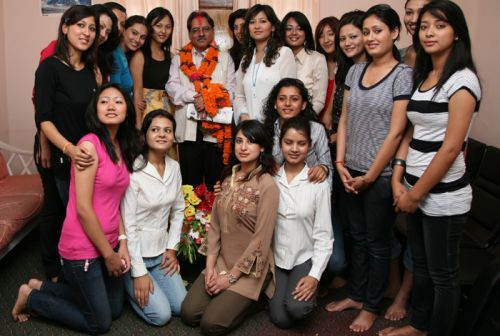 PHOTO OPPORTUNISTS: Prime Minister Dahal poses on Monday morning with Miss Nepal contestants at his home in Naya Bajar on the morning of the day he is being sworn in. Organisers of the pageant wanted Dahal to call off threats by Maoist-affiliated organisations.