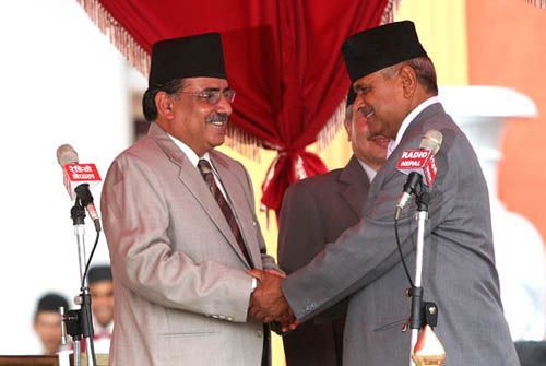 JOINING HANDS: Newly elected PM Pushpa Kamal Dahal shakes hands with President Ram Baran Yadav in the oath taking ceremony.