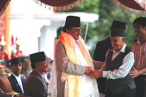 PROUD DADDY: Prime Minister Pushpa Kamal Dahal is congratulated by his father, Mukti Ram Dahal, at the Rastrapati Bhaban on Monday after his swearing in while CA speaker Subhas Nembang looks on.