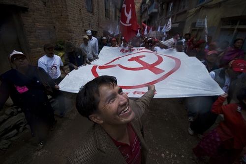 PARTY FLAG: A flag as wide as this alley in Kirtipur is paraded before a Maoist election rally at Naya Bajar on Sunday.