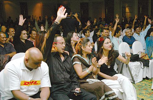 AND THE ANSWER IS...: Nabil Bank's CEO Anil Shah and DHL's Country Manager Mukunda Malla cheer for their teams at the Surya 24 Carat Boss Brainstorm Quiz on Friday. DHL took the trophy home.