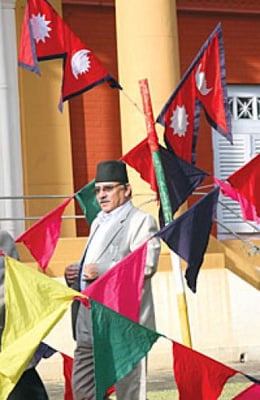 UPSIDE DOWN: Prime Minister Dahal arrives at a presidential tea party at Shital Nibas on Wednesday and passes an upside down flag.