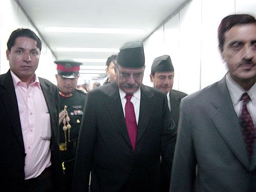 HIS OMNISCIENCE: Journalist Rishi Dhamala (in pink shirt) joins the prime minister in disembarking through the ramp at Indira Gandhi International Airport in New Delhi on Sunday.