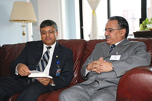 BETWEEN CAKE AND LUNCH: Nepal's UN Ambassador Madhu Raman Acharya talks to Prime Minister Pushpa Kamal Dahal during a meeting at Acharya's New York residence. on Wednesday.