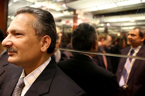 BABURAM GOES TO WASHINGTON: Finance Minister Baburam Bhattarai in the lift of the Elliot School on Thursday before addressing a gathering. In the reflection is Chitra Tiwari of the Washington Times.
