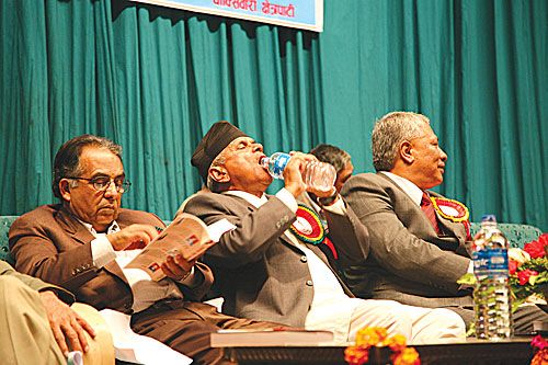 THIRSTY PRESIDENT: President Ram Baran Yadav works up a thirst at the launch of a book about Ganesh Man Singh at the City Hall on Friday.
