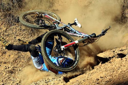 TUMBLING DOWN: A participant falls from her cycle during her final lap of the Down Hill race at the 14th Asian Mountain Bike Championship in Chobar on Sunday.