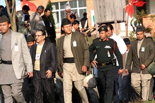 WELL GUARDED: Maoist chairman Pushpa Kamal Dahal leaving the Maoist national convention at Kharipati on Bhaktapur on Tuesday. The meeting is still debating rivals proposals by Dahal and Mohan Baidya.