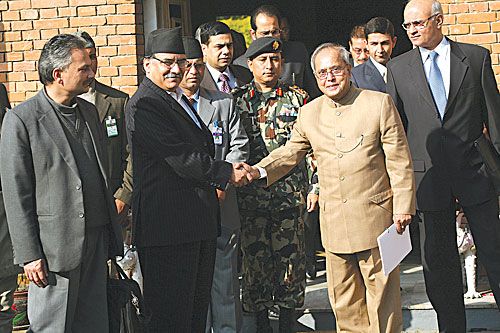 HOLD IT: Prime Minister Pushpa Kamal Dahal shakes hands with Indian Minister for External Affairs Pranab Mukherjee at the Prime Minister's residence, Baluwatar on Tuesday. On the right is Indian foreign secretary, Shiv Shankar Menon and on the left Finance Minister Baburam Bhattarai.