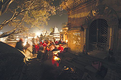 FESTIVE SPLENDOUR: Devotees celebrate Bada Chaturdasi at Pashupatinath on Tuesday night.