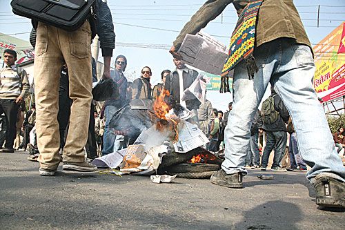 FLAMES OF FURY: Students from Thapathali Campus burn tyres on Tuesday to protest against the failure of the Public Transportation Entrepreneurs Association to drop public transport fares.