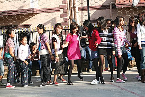 LASSES-A-LEAPING: Young girls, dressed in modern and traditional outfits, participate in Sakela Sili, a Kirati dance form, on the occasion of Udhauli festival at Nakhipot on Friday.