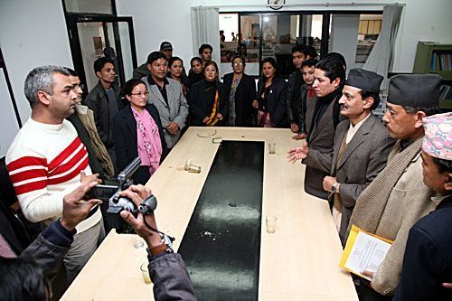 Kiran Nepal (first from the left), editor of Himal Khabarpatrika, briefs CA members about the attack in the room where the incident ocurred.