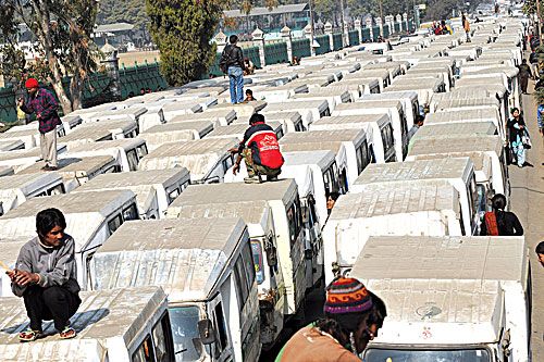 DISEMPOWERED: Operators of electric three-wheelers Safa Tempos protest near Ratna Park on Monday demanding end to power cuts as eight hours of electricity is not enough to charge their batteries and is affecting their business.