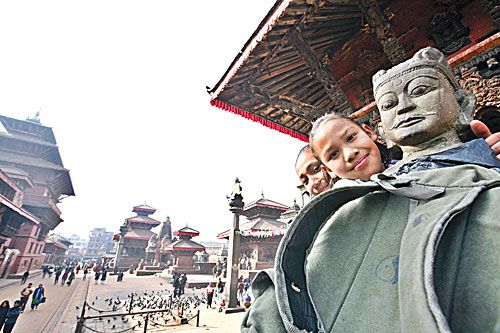 DARK SIDE OF THE SUN: School kids enjoy warm weather in Mangal Bajar on Wednesday. This week marked five months without rain for the region.