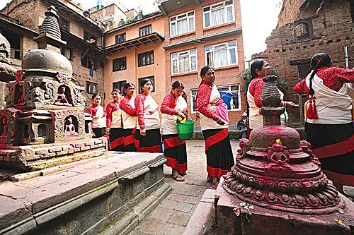 WALK THE LINE: Newari women participate in the annual Baha Puja in their traditional costumes and visit Buddhist bahas in Patan on Tuesday.