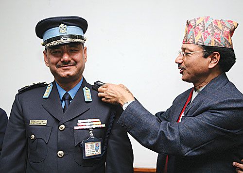 STAR ATTRACTION: Home Secretary Gobinda Kusum decorates Ramesh Chand Thakuri of the Nepal Police at the Home Ministry, following his recent promotion from DIG to IG.