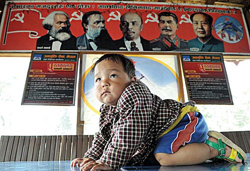 FAMOUS BABYSITTERS: One-year-old James Pun is growing up in the Shaktikhor cantonment under the watchful eyes of communist luminaries. His father and mother are both fighters in the Maoist army and admit their son's future is as uncertain as the country's.