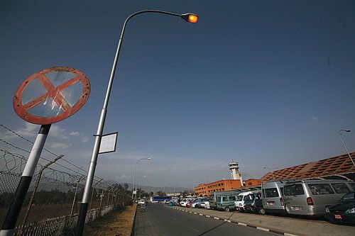 BURNING ENERGY: Street lights at the airport's parking lot were blazing away on Tuesday afternoon despite a nationalwide power crisis.