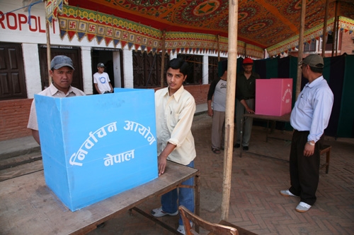MOBILE DEMOCRACY: Election workers sets up a polling station in Basantapur on Wednesday. The blue voting booth is for the first-past-the-post ballot, the pink is for the proportional representation ballot.