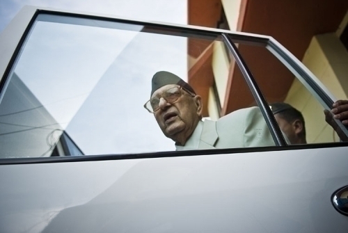 MAN IN A HURRY: PM Koirala is ushered into his car after landing at Biratnagar airport on Wednesday afternoon. He will be casting his vote in Morang-1 on election day.