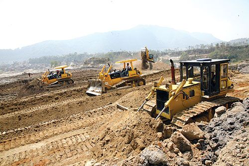 DIGGING A DREAM: Caterpillar trucks flatten a five hectare site in Kabhresthali, near Nagarjun, in preparation for the construction of an apartment complex.
