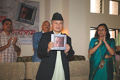 STORIES OF COURAGE: CA chair Subhas Nembang launches the photo-book Uddharko Samjhana, featuring 58 pictures taken by Nepali photojournalists of Jana Andolan II at Nepal Bar Association on Saturday.