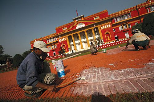 FACE LIFT: A painter at work at the premises of Shital Nibas, the office of President Ram Baran Yadav.
