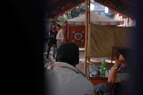 FLAWED SET UP: The interior of the booth at Kumaripati can be seen through the gap between the cloths used to cordon the voting area. The men are the in-charge overseeing its construction.