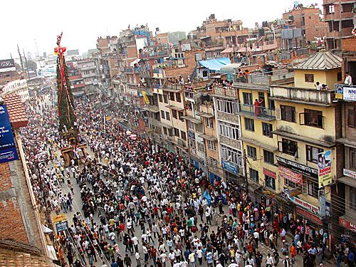 DIVINE INTERVENTION: Devotees drag the chariot of Rato Machhindranath, the rain god, through Pulchok on Wednesday, on the first day of the yearly festival.