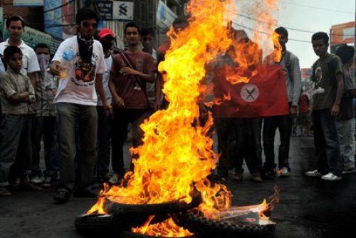FUELING THE FIRE: The streets of Kathmandu burned on Monday with protests for and against the president's move to overturn the government's decision to sack the army chief Rookmangud Katawal. The main areas remained tensed as PM Dahal announced his resignation.