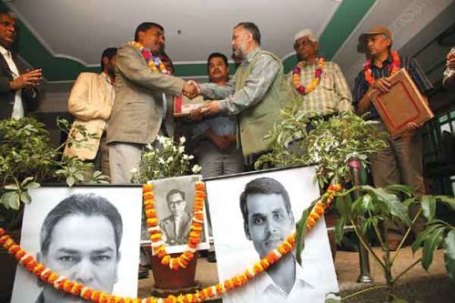 WRITE ON: Janakpur journalist Sital Shah receives an award from UML central committee member Raghuji Panta in the name of deceased writer Birendra Shah, organised by the Press Chautari Nepal on Sunday.