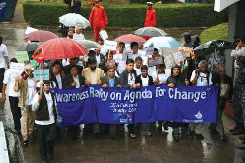 RAIN ON PARADE: Communications minister Krishna Bahadur Mahara, FNJ president Dharmendra Jha and journalists brave the rain to mark the 18th International Press Freedom Day at City Hall on Sunday.