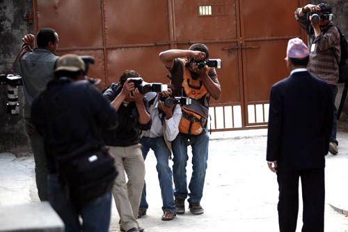 LOVING THE LIMELIGHT: UML leader Madhav Kumar Nepal poses as photo journalists flock his residence to click pictures of Nepal's next prime minister.