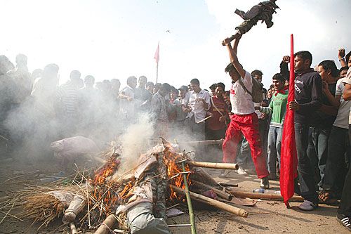 FAN THE FLAMES: Maoists continue their protests against the president's move to reinstate Army Chief Rookmangud Katawal by burning effigies at Khula Manch on Sunday.