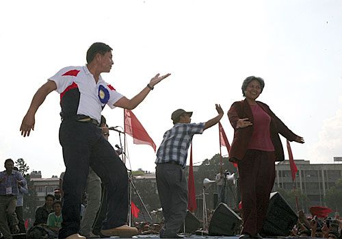 SMOOTH MOVE: PLA Commander Nanda Kishor Pun (Pasang) takes part in the Maoist mass gathering alongside Minister of Tourism Hisila Yami at Khula Manch on Sunday.