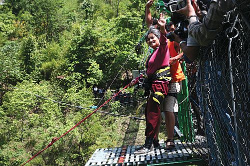 HIGH FLYER: Tourism Minister Hisila Yami braces herself to swing from the bridge at the Last Resort on Friday.