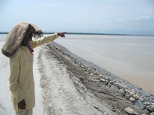 FORCES OF NATURE: A Kosi local points at the area flooded last year where three newly constructed cofferdams were again destroyed this week. Reconstruction has resumed after the rainfall ceased on Wednesday.