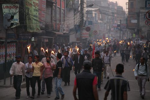 HERE WE GO AGAIN: Maoist party workers take out a torch rally from Santi Batika to Putalisadak on Friday against the overturning of the Maoist-led government's decision to sack Army Chief Rookmangud Katawal.