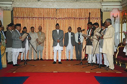 WE SWEAR: Prime Minister Madhav Kumar Nepal administers oath of office to new minsters from Madhesi Janadhikar Forum and Tarai Madhes Loktantrik Party at Shital Nibas on Wednesday. President Ram Baran Yadav was also present at the ceremony.