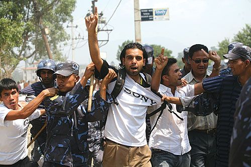 BLACK IS BACK: Police arrest a member of Revolutionary Left Wing, a breakaway Maoist faction, on Saturday near Tribhuban International Airport for protesting against 'border enroachment' by India in Nepal and showing a black flag to the Indian Foreign Secretary Shiv Shankar Menon .