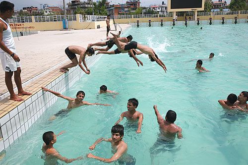 COOL DESCENT: With the delayed onset of the monsoons and rising temperatures, Satdobato swimming pool attracts crowds of locals eager to cool down.