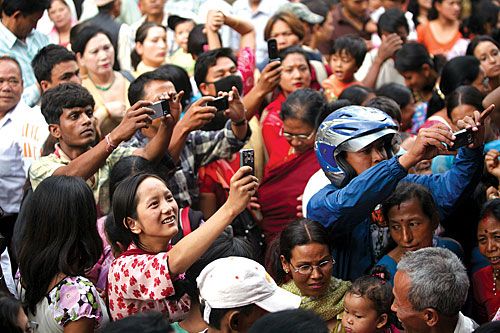 MOBILENATH: A devotee uses her mobile to take a picture of the Patan Kumari during the Machhendranath chariot procession last week.