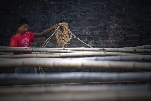An election worker uses rope to demarcate queues at the Janpath School, the voting centre for Morang-6, Biratnagar.