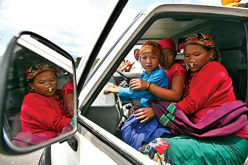 REFLECTED GRIEF: Relatives of Jaya Bahadur Pun Magar of Rolpa, who was killed in a ship mishap in the Persian Gulf off Doha, receive his body at Tribhuban International Airport on Saturday.