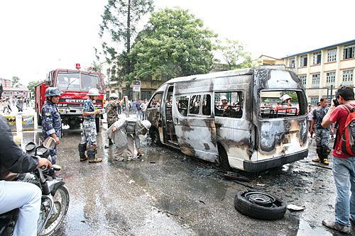 BURNOUT: Members of Nepal Student Union set ablaze a microbus on Tuesday during a chakkajam at Jamal held in protest of an attack on a peer at White House College the day before.