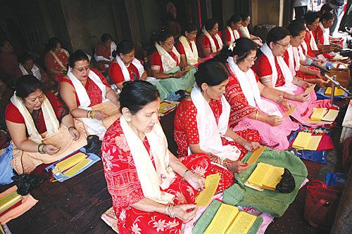 HOLY MURMURS: Worshippers chanting Buddhist prayers during an annual month-long festival for peace in Swayambhu last week. .