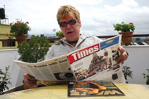 THE REAL THING: Elton John look-a-like Eldon John browses the Nepali Times on Sunday in Thamel where he helps to run a hotel.