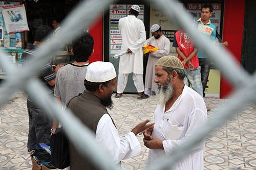WISE WORDS: Two men greet one another on Monday at Kashmir Masjid near Ghanta Ghar. Muslims worldwide began fasting for the holy Islamic month of Ramadan on 22 August.