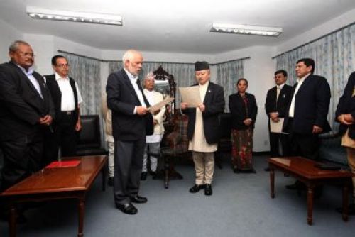 Swearing in: CA chair Subhas Nemwang administers the oath of office to newly elected chairman of the Constitutional Committee Nilambar Acharya on Saturday.